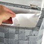 Grauer, halbrunder Kobolo Wäschekorb aus Nylon mit gepolstertem Deckel und Textilfutter.