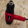 Einhell Heißluftpistole TE-HA 2000 E, rotes Gehäuse mit schwarzem Aufsatz und silberner Düse.