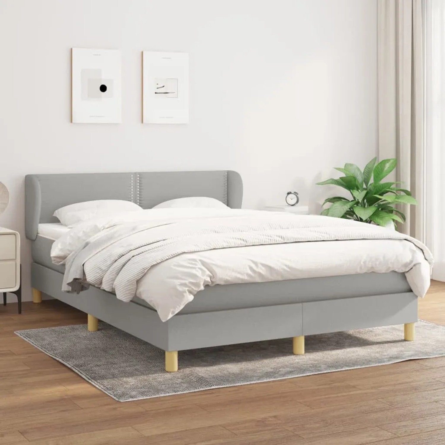 Hellgraues vidaXL Boxspringbett 140x190 cm mit Matratze und Kopfteil.