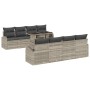 Hellgraues 7-teiliges Garten-Sofa-Set aus Poly Rattan mit Tisch und Kissen.