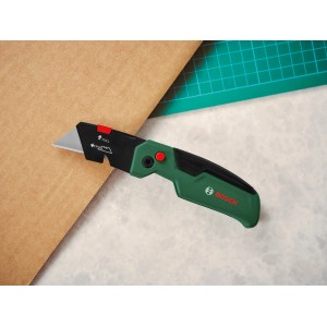 Bosch Klappmesser mit grüner Griffschale und ausfahrbarer Klinge.