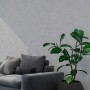 Graue Uni Vliestapete von PROFHOME im Raum mit Sofa und Pflanze.