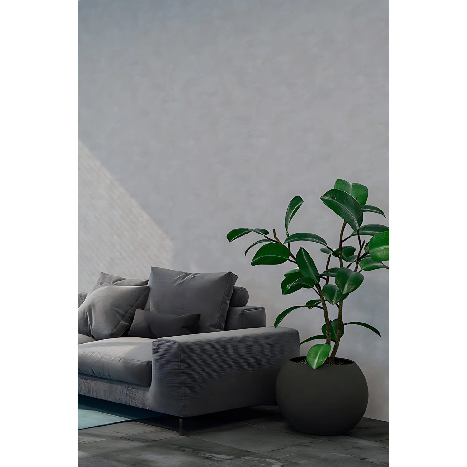 Graue Uni Vliestapete von PROFHOME im Raum mit Sofa und Pflanze.