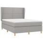 Hellgraues vidaXL Boxspringbett 140x190 cm mit Matratze und Kopfteil.