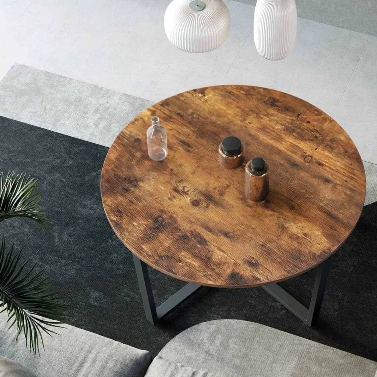 Runder Couchtisch Indie im Industrie-Stil mit Holzplatte und Metallgestell.