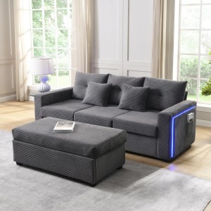 Graues L-Sofa 3-Sitzer aus Cordstoff mit blauer LED-Beleuchtung an der Armlehne und passendem Ottoman.