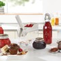 Leifheit Cherrymat Kirschentkerner in Grün mit Kirschen, Marmelade und Gebäck.