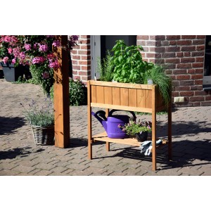 Braunes Dobar Hochbeet mit Ablagefläche, bepflanzt mit Kräutern und Gemüse.