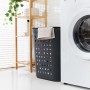 Anthrazitfarbener Rotho Wäschesammler Jona (55 l) mit Handtuch im Badezimmer.