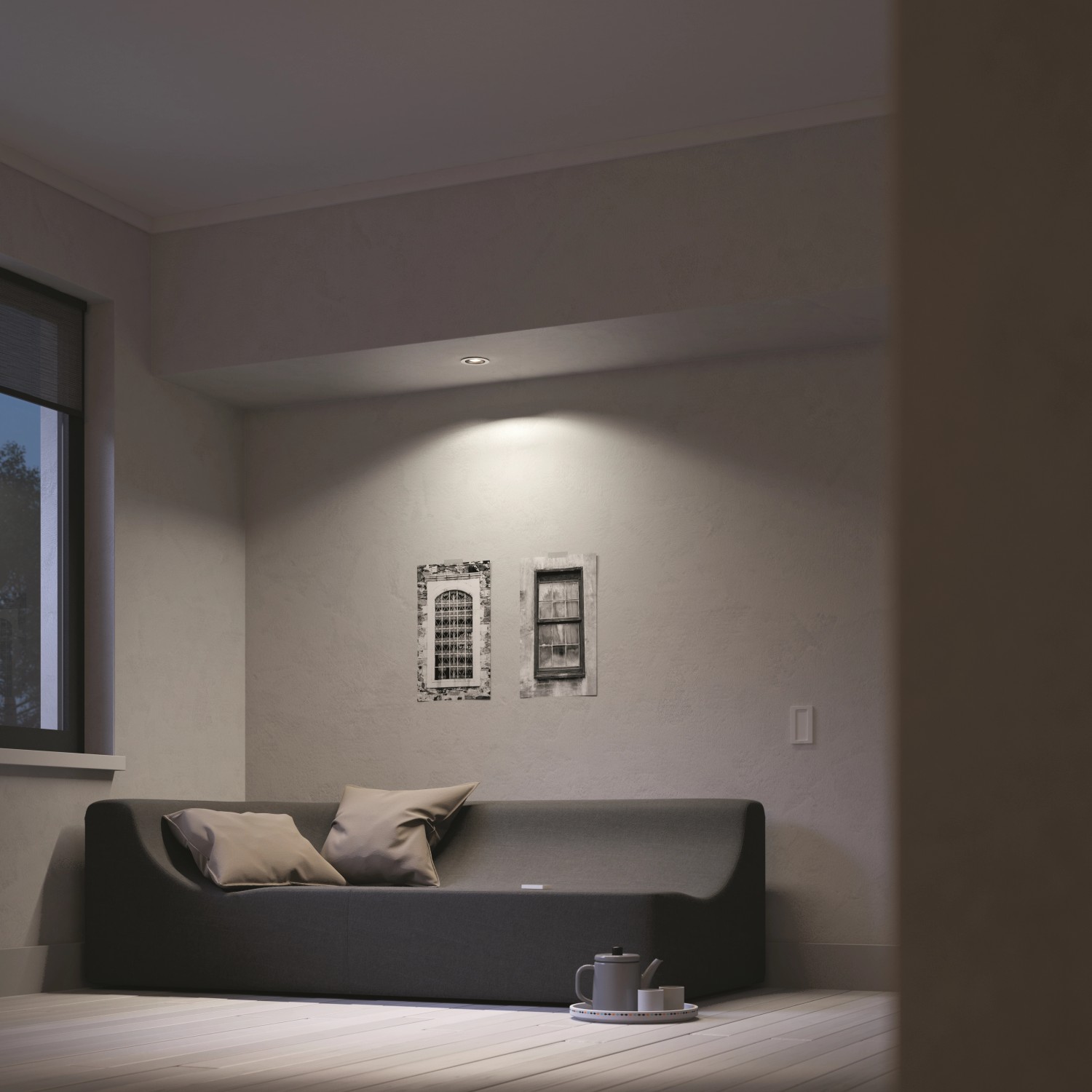 Wohnzimmer mit Philips Hue LED Einbauspot Milliskin, der warmweißes Licht spendet.