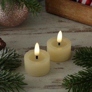 Zwei creme Echtwachs LED Teelichter mit Timer in rustikaler Optik, D 4,4cm.