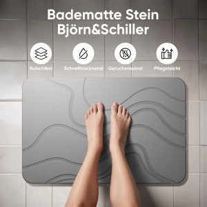 Graue Björn&Schiller Kieselgur-Steinmatte (60x39 cm) mit Wellenmuster, rutschfest und schnelltrocknend, Füße darauf.