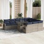 Graue 11-tlg. Garten-Sofagarnitur aus Polyrattan mit marineblauen Kissen und Tisch.