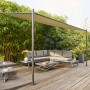 Grauer Siena Garden Pavillon Levino 300x400 cm mit Stahlgestell und Stoffdach im Garten.
