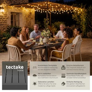 Dunkelgrauer ausziehbarer Aluminium Gartentisch für 4-6 Personen, Lamellendesign, mit Gästen auf Terrasse.