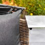 Detailansicht: Merxx Relaxinsel Riva Premium mit grauem Kissen und Edelstahl-Tisch.