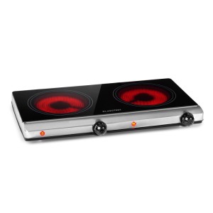 Klarstein Cookbuddy Doppel-Kochfeld aus schwarzer Glaskeramik mit zwei rot glühenden Kochzonen und silbernem Rand.