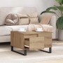 Quadratischer Couchtisch Artisan Eiche mit Schublade und schwarzen Metallfüßen.