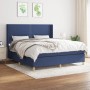 Blaues Boxspringbett (180x200 cm) mit Matratze und Kopfteil im Schlafzimmer.