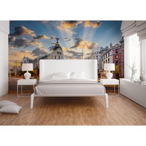 Fototapete Gran Via Madrid in Blau, Grau, Weiß und Gelb im Schlafzimmer.