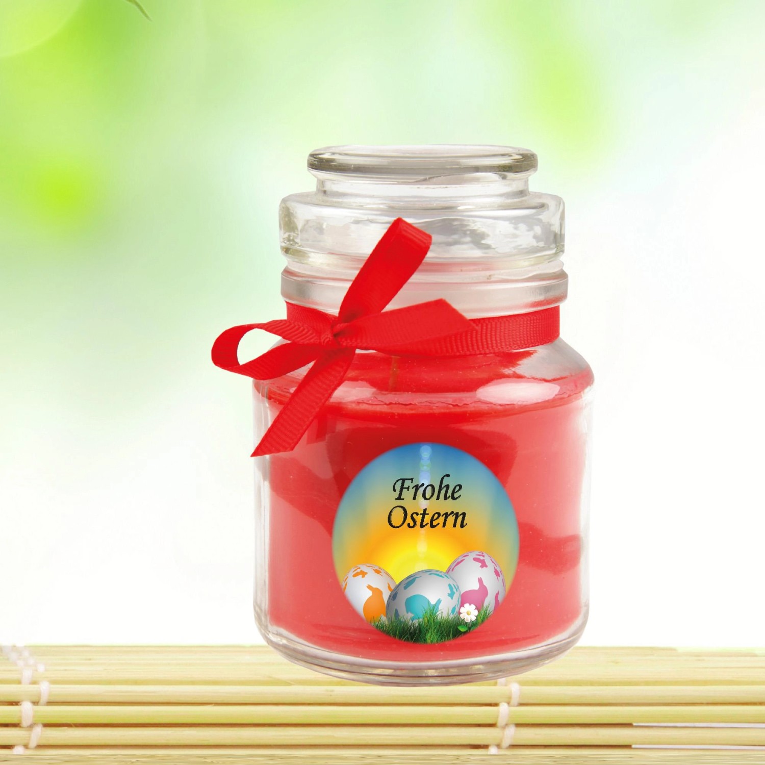 Duftkerze "Frohe Ostern" im Glas mit roter Schleife, Ø7cm, Rose. Osterdeko für gemütliche Atmosphäre.