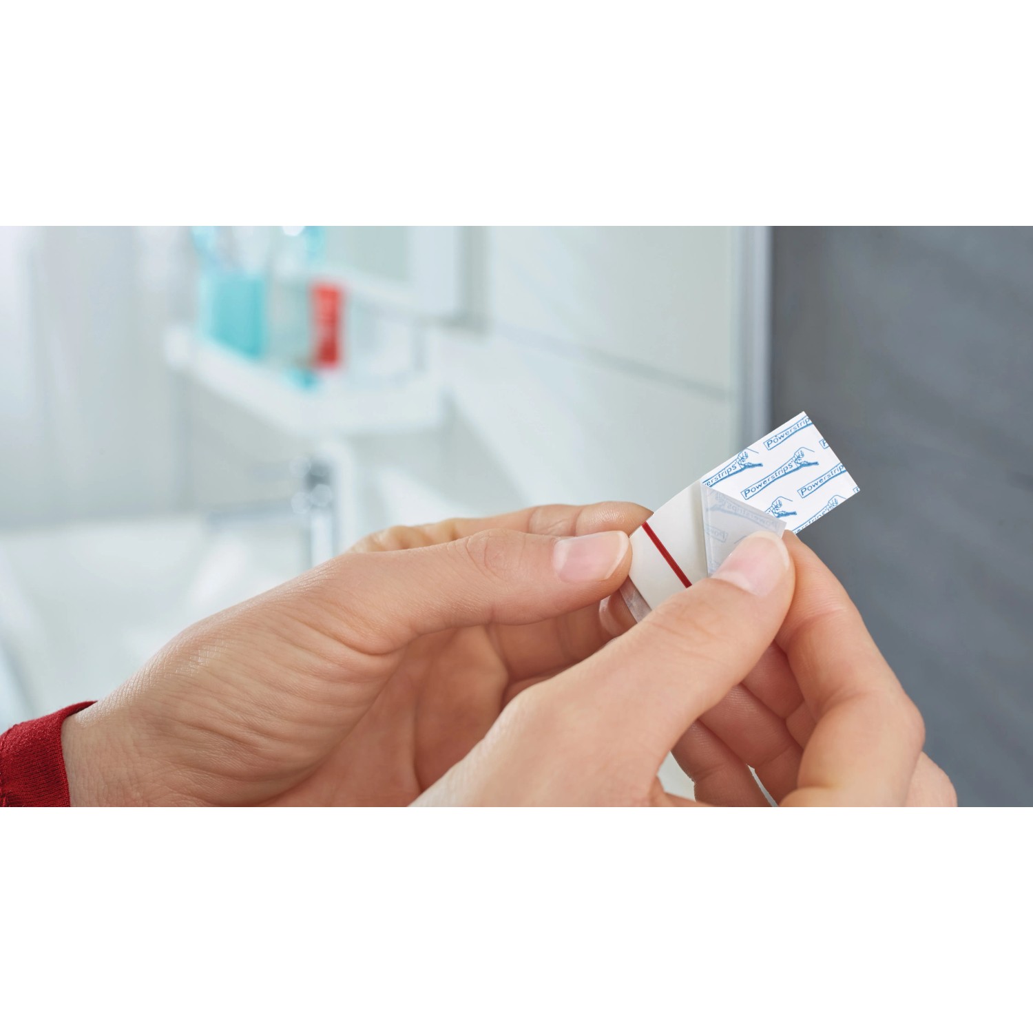Anwendung: Tesa Powerstrips Waterproof Klebehaken, eckig, Edelstahl, Large. Hält bis zu 2 kg.
