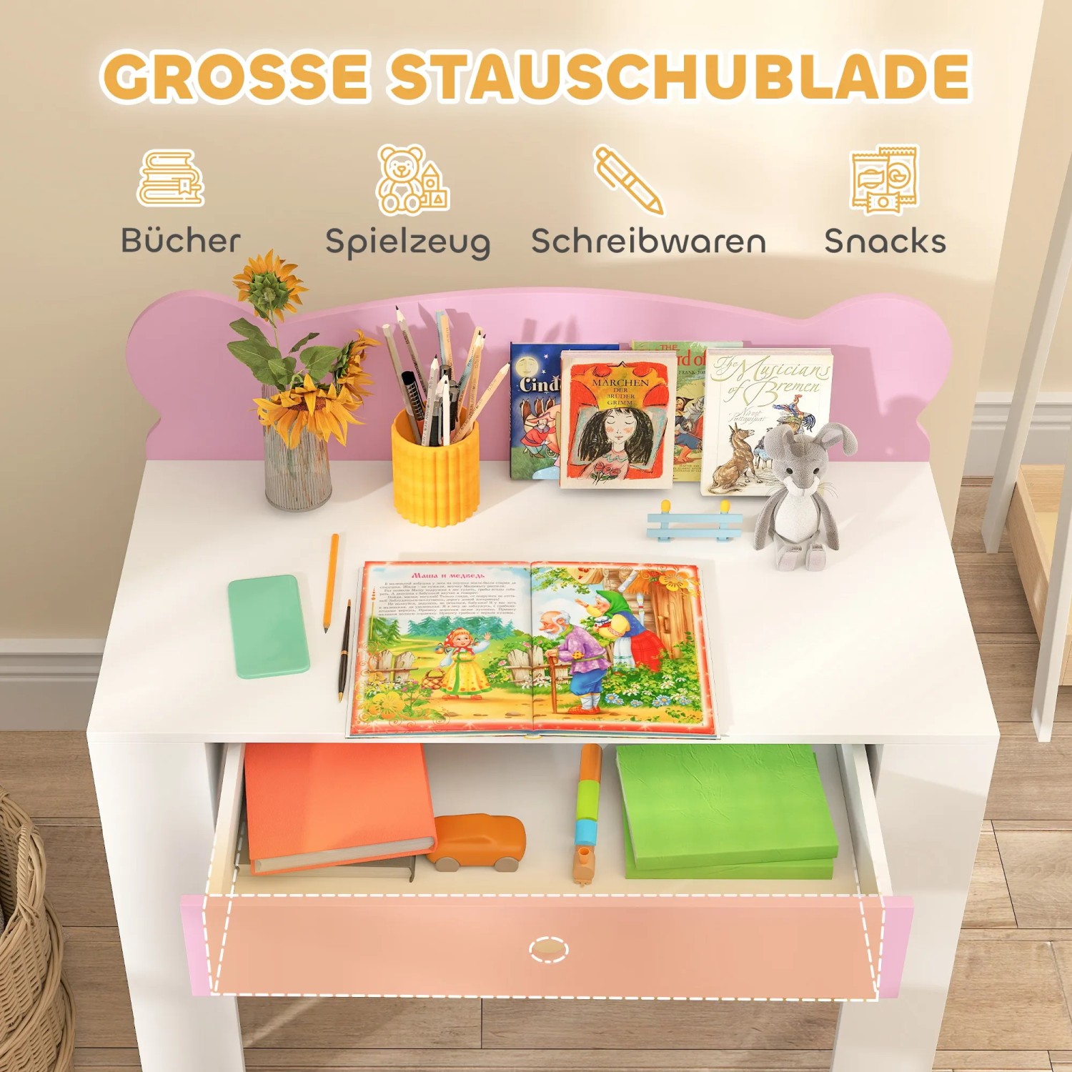 AIYAPLAY Kinderschreibtisch Set rosa-weiß mit Schublade, gefüllt mit Büchern und Spielzeug.
