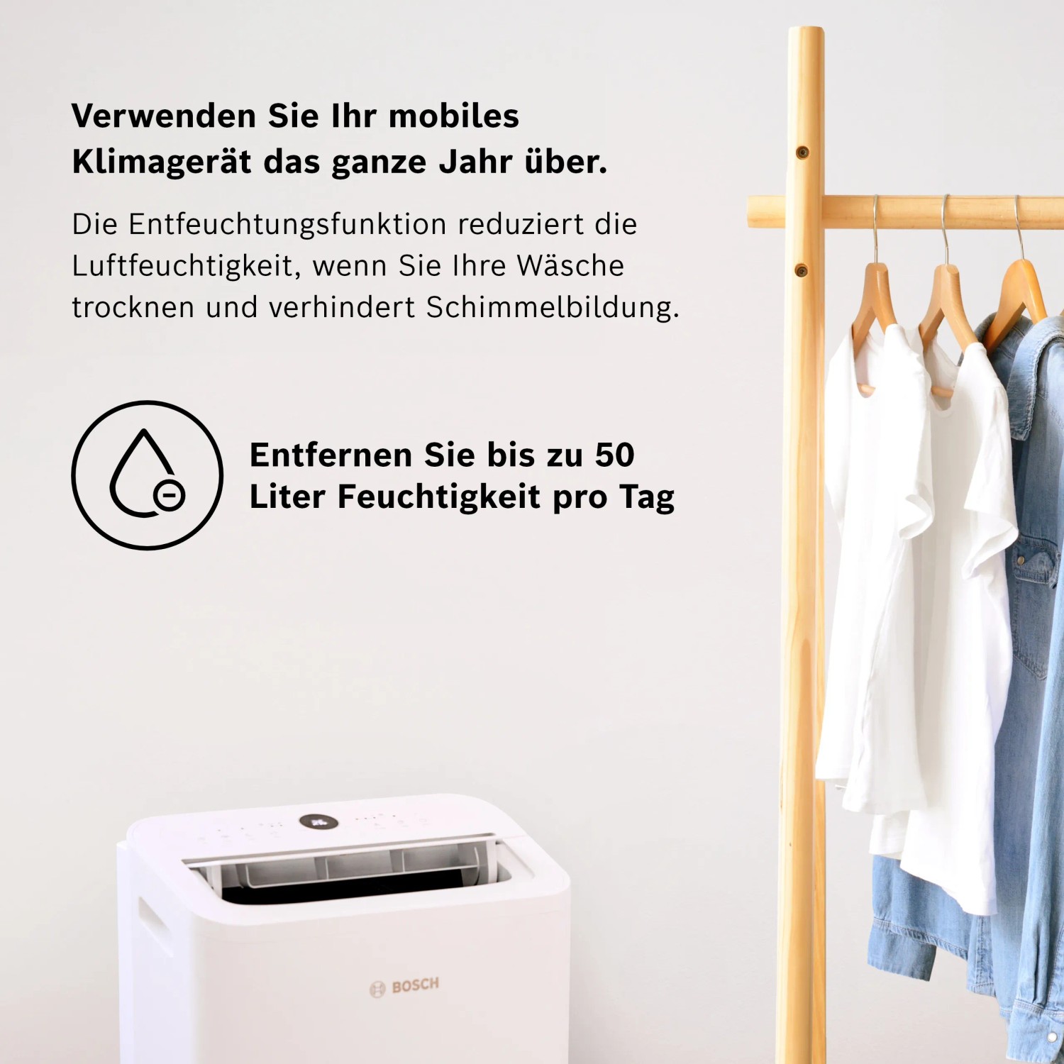 Weißes Bosch Klimagerät Cool 2000 mit Wäscheständer, zur Reduzierung der Luftfeuchtigkeit.