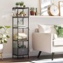 Schwarzes Songmics Standregal mit 5 Ebenen und transparenten Platten im Wohnzimmer.