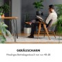 Mann liest entspannt im Sessel, Klarstein Klimaanlage sorgt für Ruhe.