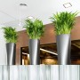 Lechuza Delta Premium Pflanzgefäß, anthrazit metallic, mit grünen Pflanzen in modernem Ambiente.