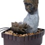 Zimmerbrunnen Buddha mit Lotusblüte in Steinoptik und Deko-Steinen.