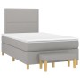 Hellgraues Boxspringbett 120x200 cm mit Matratze und Bank, Stoffbezug.