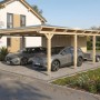 Skan Holz Carport Emsland aus Naturholz mit Flachdach und Abstellraum. Bietet Platz für zwei Fahrzeuge.