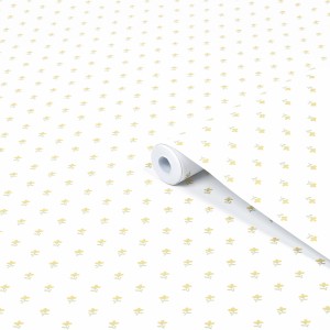 Laura Ashley Vliestapete Wood Violet in Ockergelb mit floralem Muster, Rolle teilweise abgerollt.