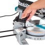 Makita LS0815FLN Kapp- und Gehrungssäge mit Hand am Einstellknopf für präzise Schnitte.