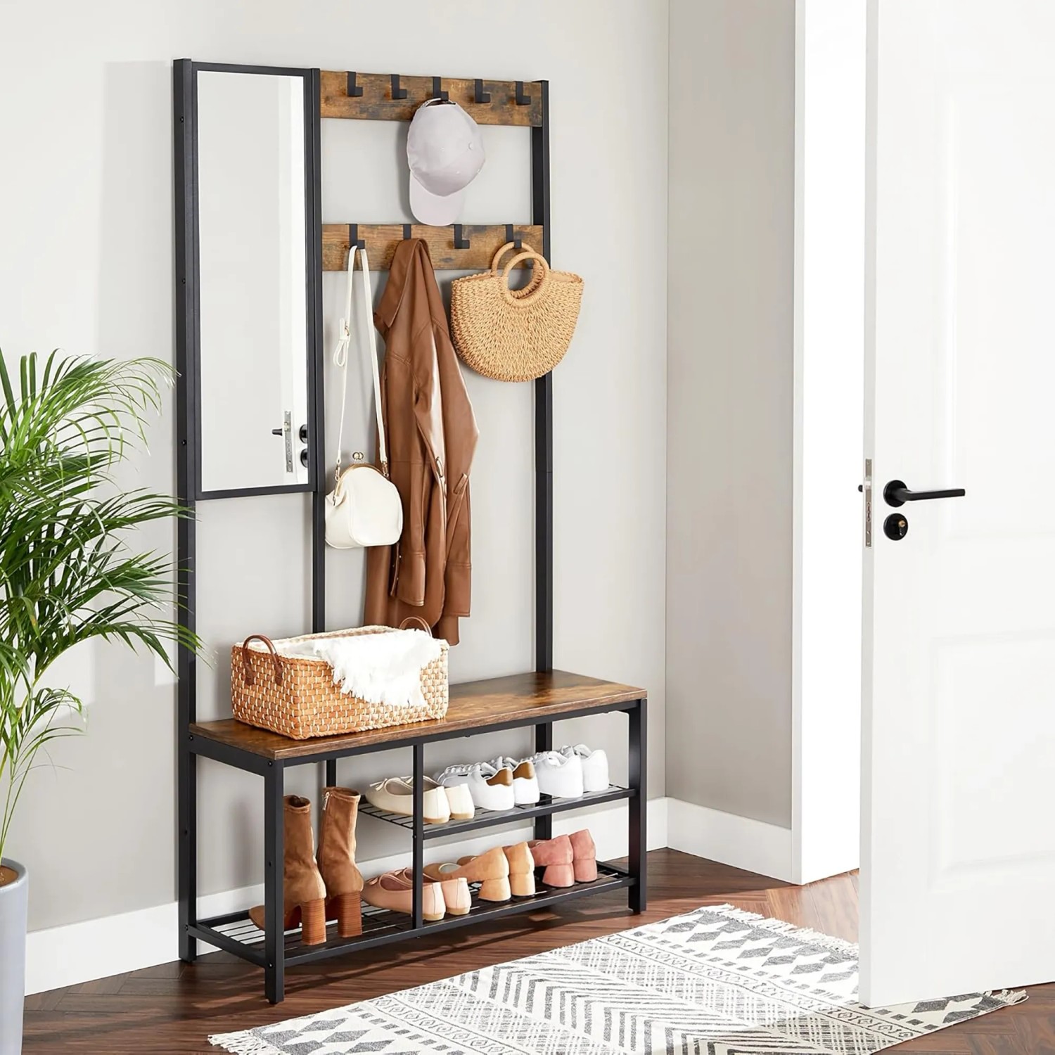 Songmics Garderobe mit Spiegel, Bank, Schuhregal und 9 Haken in Braun-Schwarz.