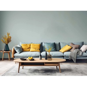 Wohnraum mit hellgrüner Erfurt Vliesfaser Colour 302-8 Tapete und blaugrauem Sofa.