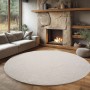 Runder, creme-farbener Ayyildiz Flachgewebeteppich Helix (Ø 80 cm) im Wohnzimmer.