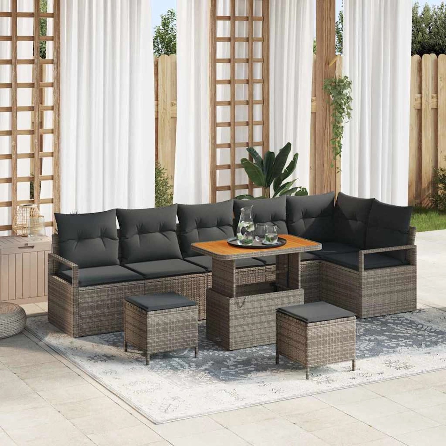 Graues 9-teiliges Garten-Sofa-Set aus Poly Rattan mit Tisch und Hockern.