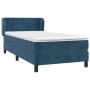 Dunkelblaues Boxspringbett 90x190 cm mit Matratze und Kopfteil aus Samt.