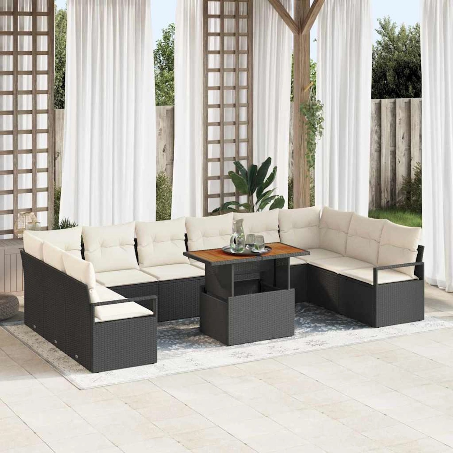 Schwarzes vidaXL Garten-Sofa-Set mit Stauraum und Tisch auf Terrasse.