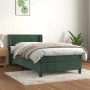 Dunkelgrünes Boxspringbett (90x190 cm) mit Matratze und Samtbezug. Bett mit hohem Kopfteil.