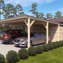 Holzbrüder Doppelcarport Ralf mit Geräteraum, naturbelassen, mit zwei parkenden Autos.