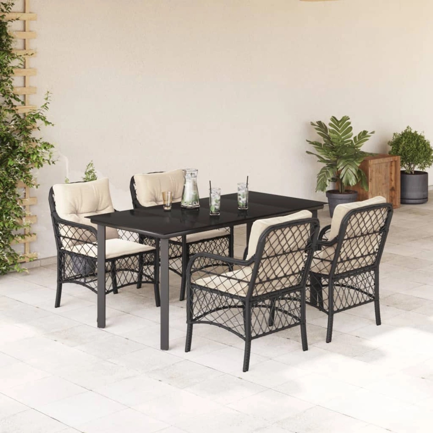 Schwarze 5-tlg. Garten Essgruppe aus Polyrattan mit Tisch, 4 Stühlen und Kissen.
