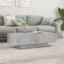 Moderner, betongrauer Couchtisch (100x49,5x31 cm) aus Holzwerkstoff im Wohnzimmer.