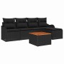 Schwarzes 6-teiliges Garten-Sofa-Set aus Poly Rattan mit Tisch und Auflagen.