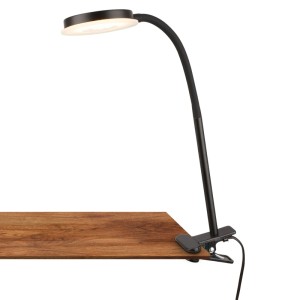 Schwarze Briloner LED-Klemmleuchte mit schwenkbarem Kopf und Lichtkante am Tisch.
