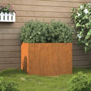 Rostiger Cortenstahl Pflanzkübel 62x47x46 cm mit grüner Pflanze im Garten. Ideal für Balkon & Terrasse.