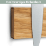 DELUKE Magnetleiste aus Eichenholz mit deutlicher Maserung, hält ein Küchenmesser. Starker magnetischer Messerhalter.